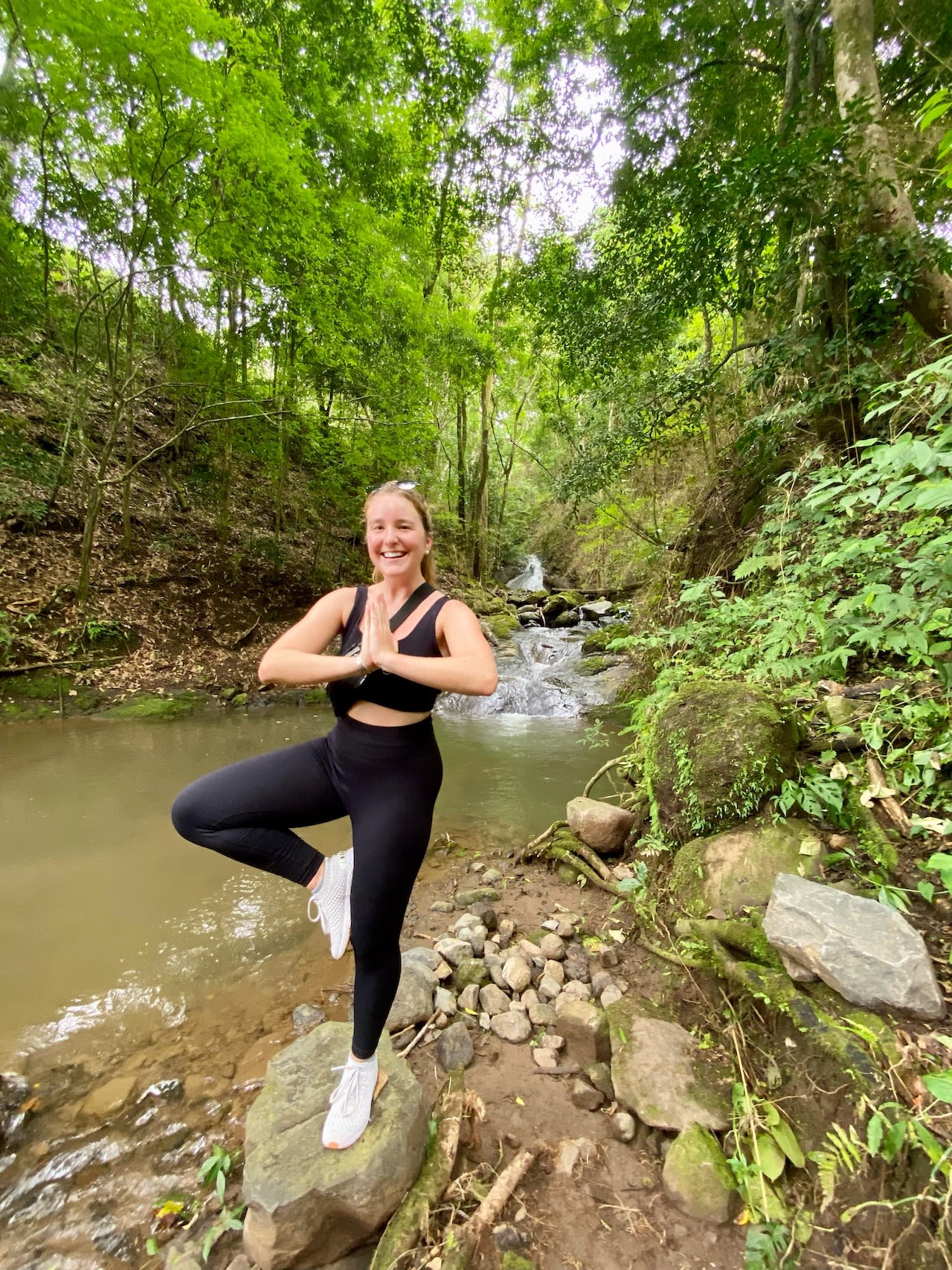 Yoga post on rainforest hiking trail in Costa Rica